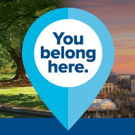Map marker icon with text in the center that reads"You belong here."