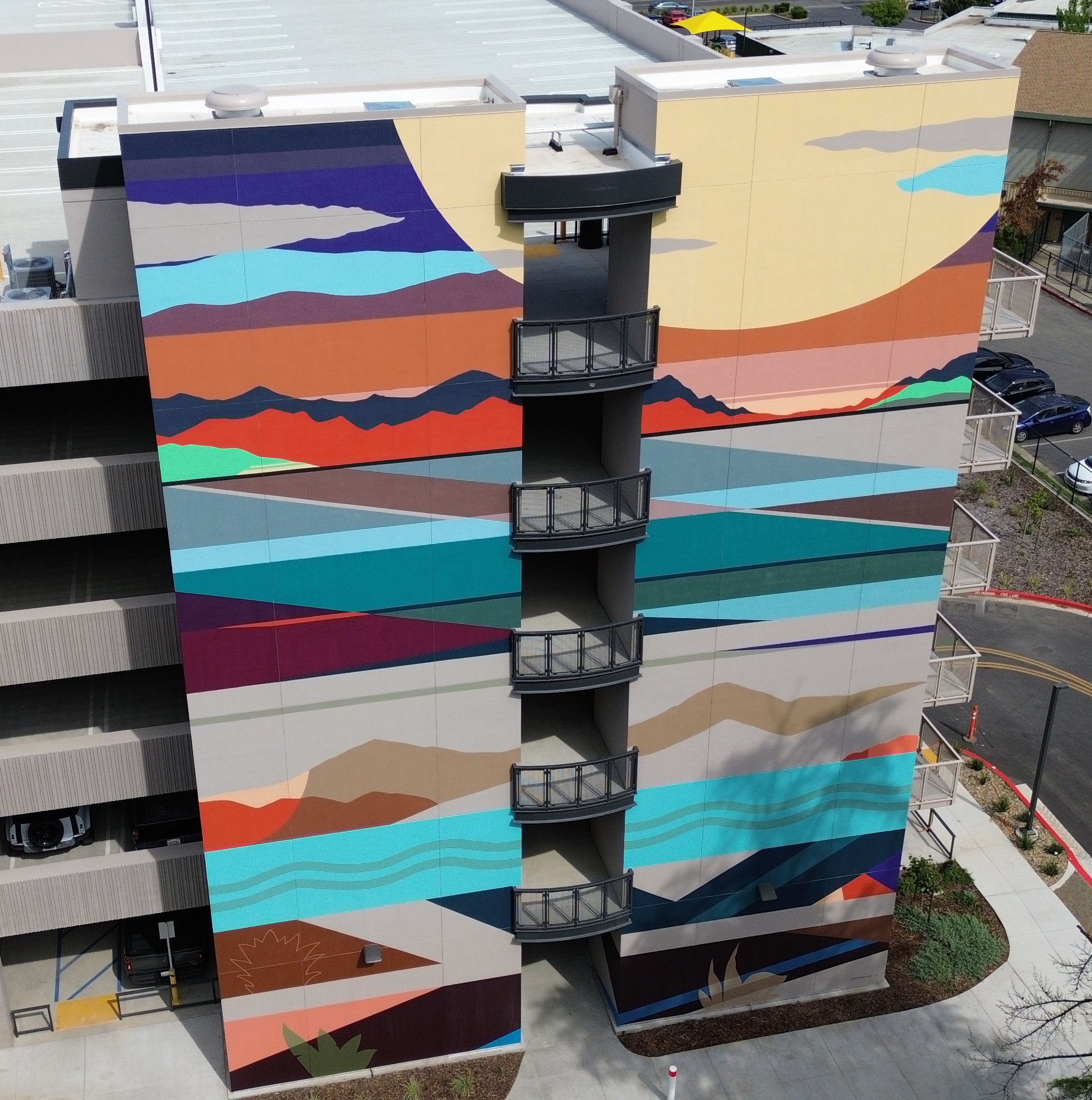 Colorful abstract art mural on the wall of a parking structure