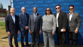 Darrell Steinberg, Jay Schenirer, Gary May, Joany Titherington and others stand together at the press conference.
