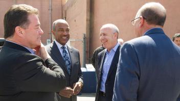 Chancellor May and Mayor Steinberg talk in a group with two other people.