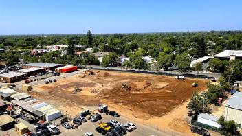 Aerial view of the Mixed-use Residential Building construction site in June