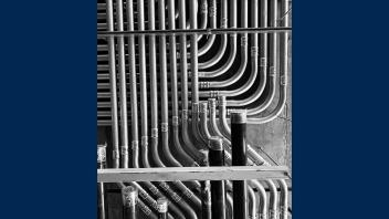 Black and white detail of intricate piping looks like abstract modern art.