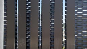 A mechanical screen with horizontal perforations 