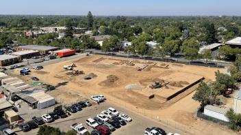 Aerial view of the Mixed-use Residential Building construction site in July