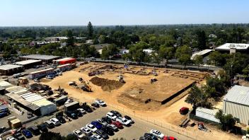 Aerial view of the Mixed-use Residential Building construction site in August