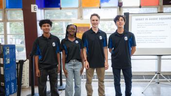 Four students who led the session pose for a photo together
