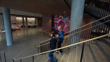 Two people walking down stairs