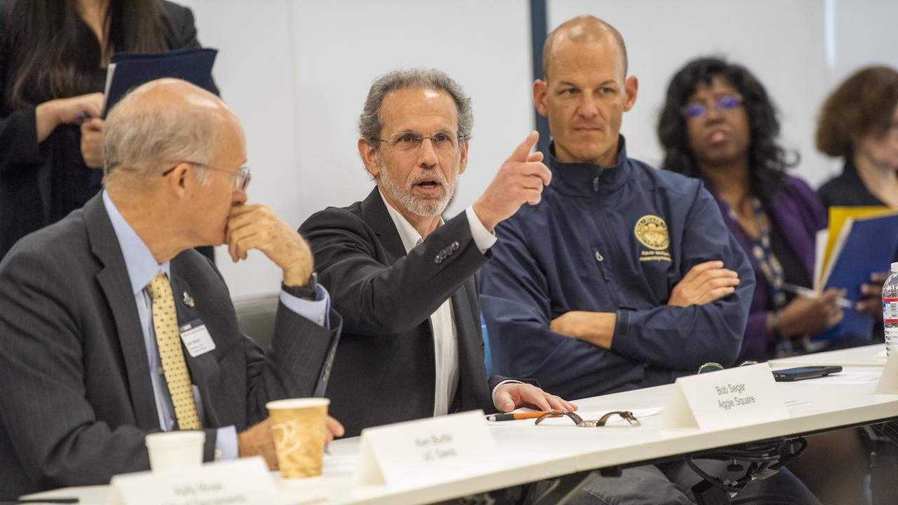 Bog Segar speaks while sitting on a panel