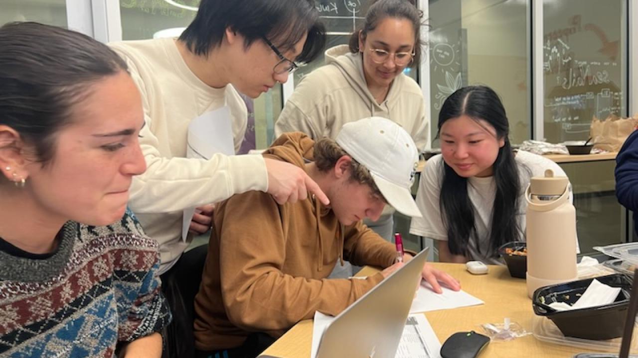 A group of students at a table talking
