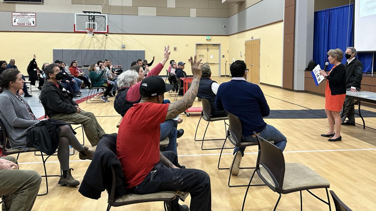 Image of an Aggie Square community engagement meeting in the multipurpose room of the Oak Park Community Center.