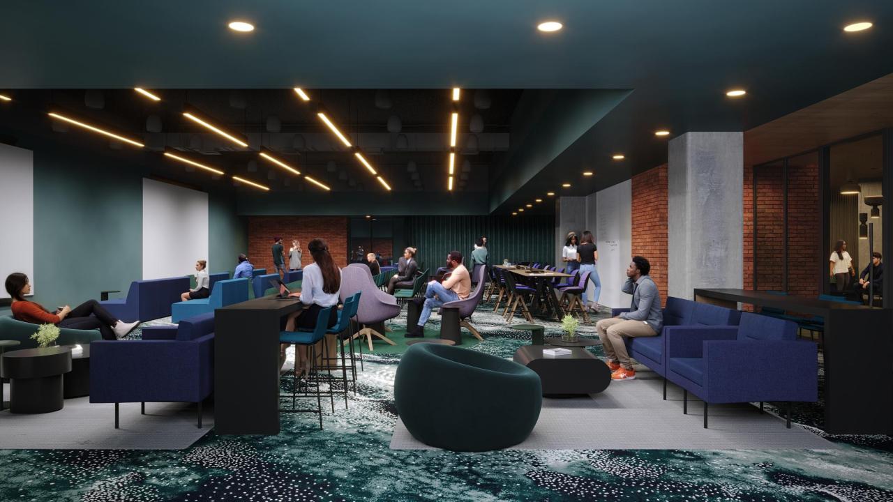 A large room with several chairs and tables where people socialize or study