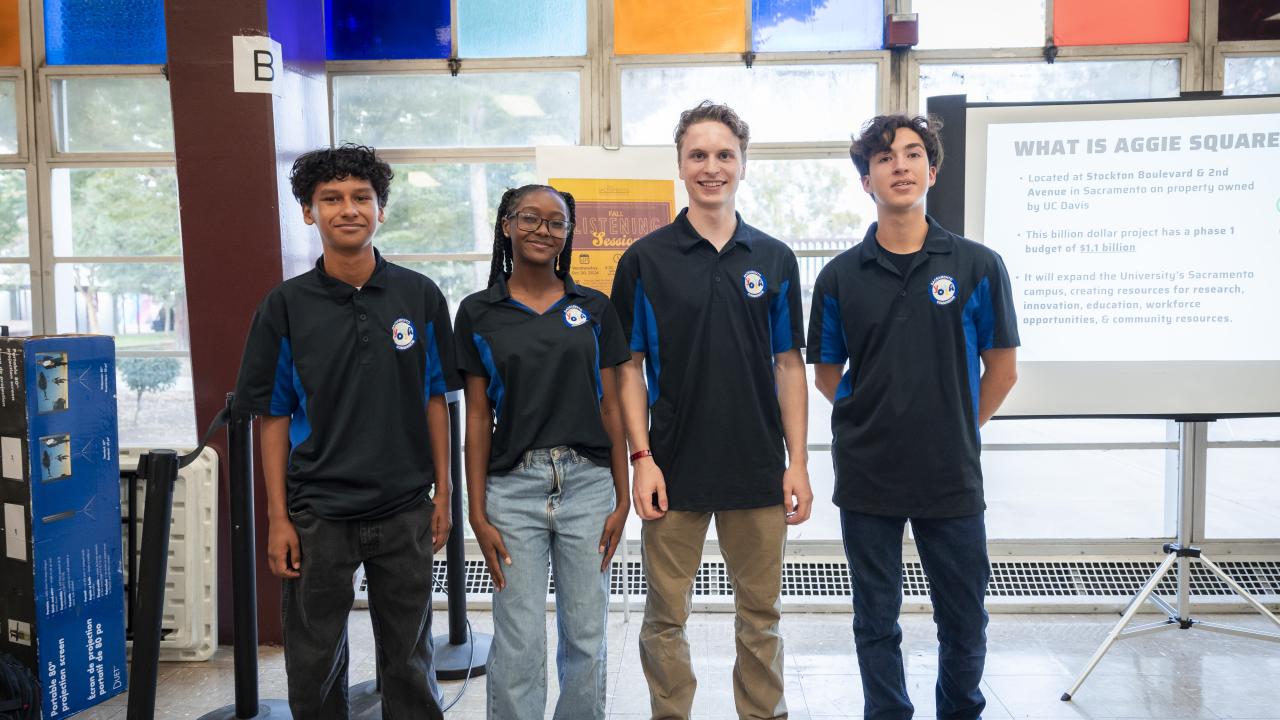 Four students who led the session pose for a photo together