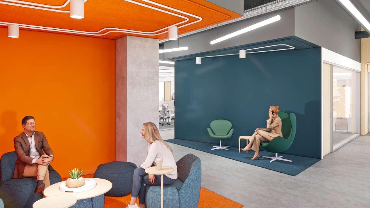 Rendering of an open office space with two people talking at a table and one person walking in through the door