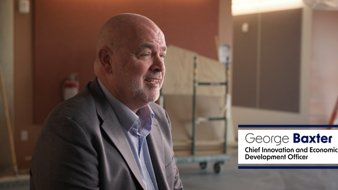 A photo of George Baxter with text of his name and title, UC Davis' Chief Innovation and Economic Development Officer