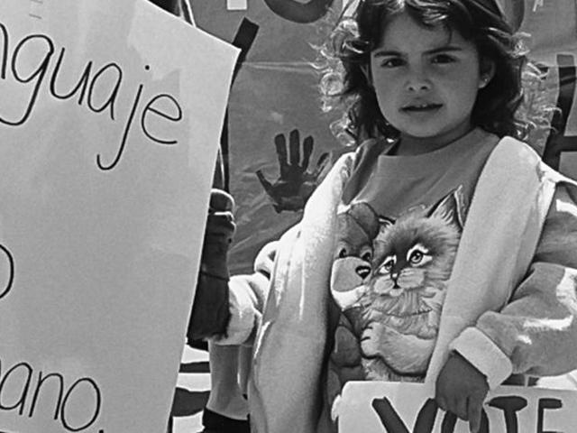 Image of child at march supporting education.