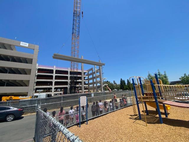 Students outside the Aggie Square construction site