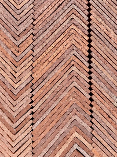 Thin L-shaped bricks stacked to create a geometric pattern