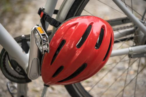 Bike helmet hanging off of bike