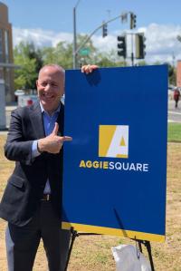 Mayor Steinberg poses for a photo next to the Aggie Square poster on the UC Davis Health campus. Mayor Steinberg poses for a photo next to the Aggie Square poster on the UC Davis Health campus.