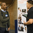 Two people talk at a UC Davis job fair