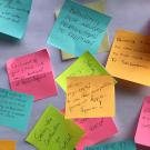 Post-It notes on a board share messages that are in the story