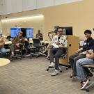 A group of people listening to presenters