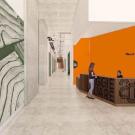 A hallway with a reception desk where two people talk