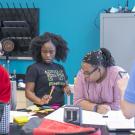 Middle school students work on a project